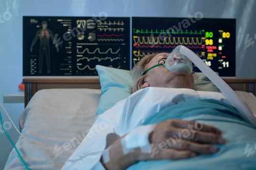 Preview: Close-up of covid-19 patient in bed in hospital, coronavirus and ventilation concept.