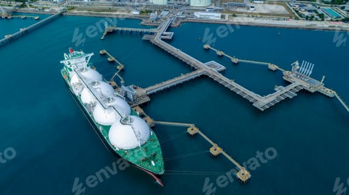 Preview: LNG (Liquified Natural Gas) tanker anchored in Gas terminal gas tanks for storage. Oil
