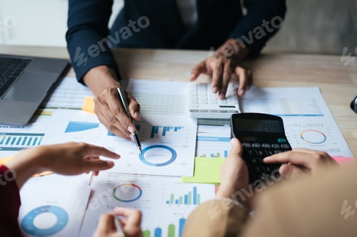 Preview: Team Analyzes Financial Data with Calculators and Pen