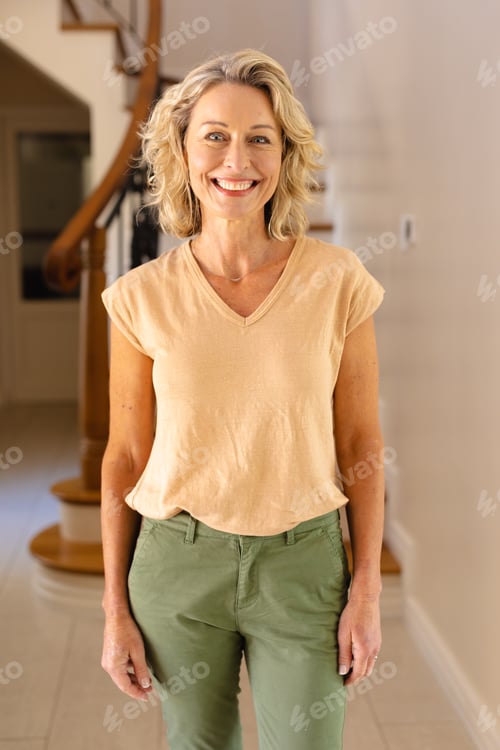 Smiling Woman Standing in Home Foyer