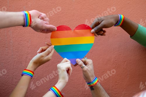 Preview: Activists holding rainbow heart symbol of lgbtq plus community