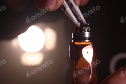 Preview: test burning the new dual coils on the atomizers deck base of electronic cigarette for vaping, close