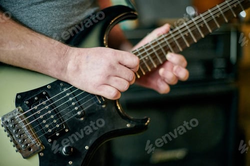 Preview: Guitarist Playing Electric Bass Guitar Close Up