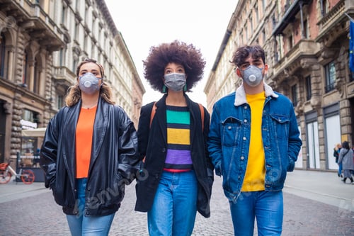 Preview: Three multiethnic friends wearing medical mask protecting from pollution and virus