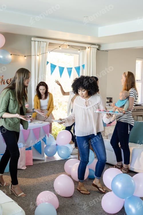 Preview: Women celebrating at home, decorating with balloons and enjoying festive atmosphere