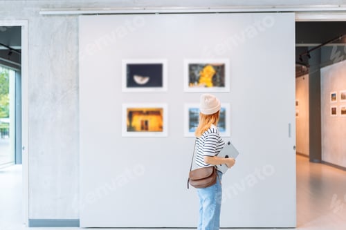 Preview: Woman visiting art gallery her looking pictures on wall watching photo frame painting at artwork mus