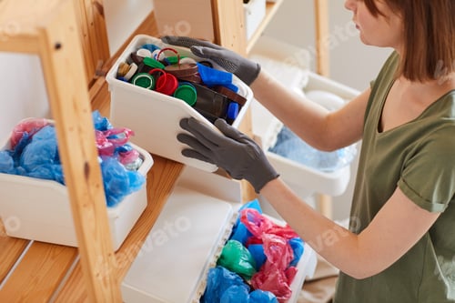Preview: Woman Storing Materials for Recycling