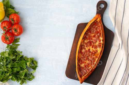 Preview: Turkish baked Pide bread on light blue wooden surface