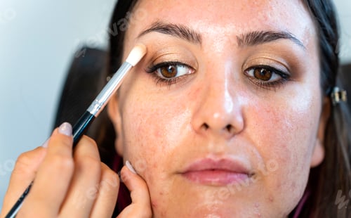 Preview: Close-up of a girl with skin disease being made up.