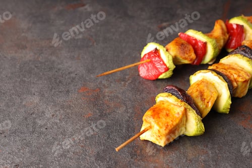 Preview: Tasty chicken shashlik on dark textured background