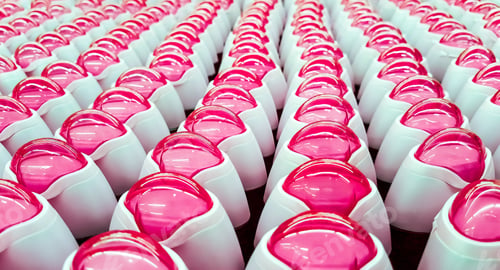 Preview: Deodorant, bottles with pink lids in a row.