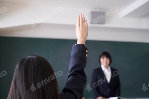 Preview: A Japanese junior high school girl raises her hand in the classroom