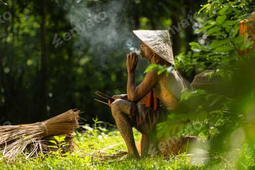 Preview: A tattooed elderly man smoking a cigarette in the garden