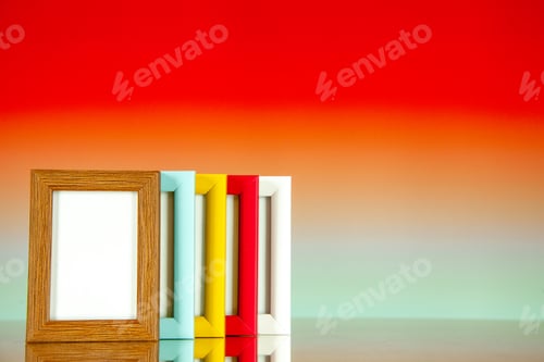 Preview: front view different picture frames with colored corners on light red background picture family