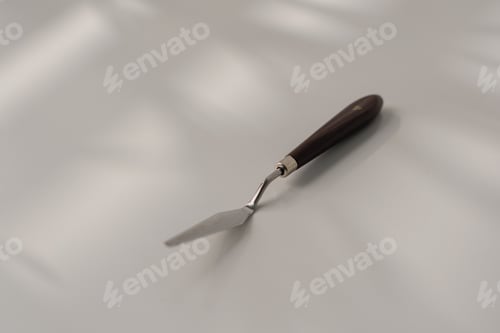 Preview: pastry spatula palette knife cooking utensils for cakes on the table on white background close-up