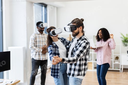 Preview: Group of professionals using virtual reality glasses for fun and entertainment