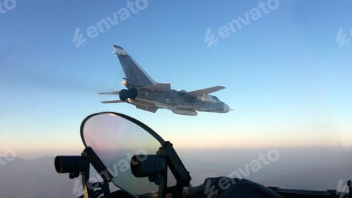 Preview: Military jet bomber Su-24 Fencer flying above the clouds.
