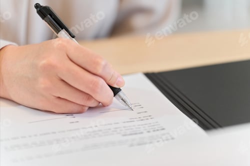 Preview: A woman signing a real estate contract