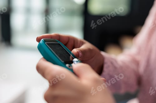 Preview: Nurse doing insulin level measurement with instrument