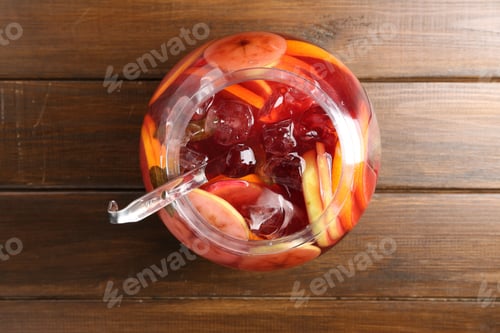 Preview: Tasty fruity punch on wooden table, top view. Refreshing drink