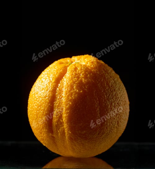 Preview: orange fruit on black background