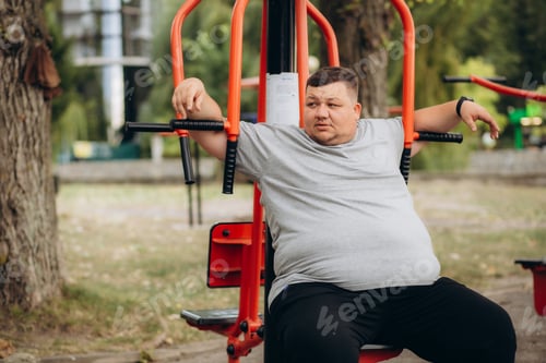Preview: a fat man is doing sports in the park