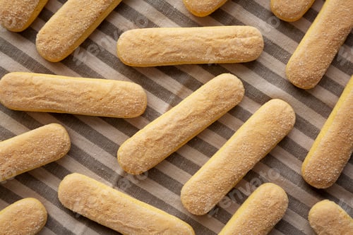 Preview: Savoiardi biscuits on a plate, top view. Close-up.