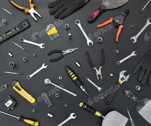 Preview: Handyman tool kit on black wooden table. Many wrenches and screwdrivers