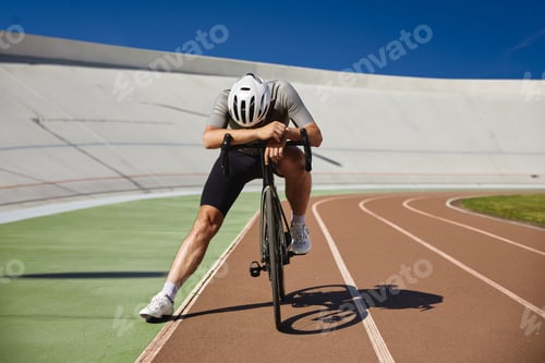 Preview: Tired exhausted bicyclist athlete stopped after hard cycling training