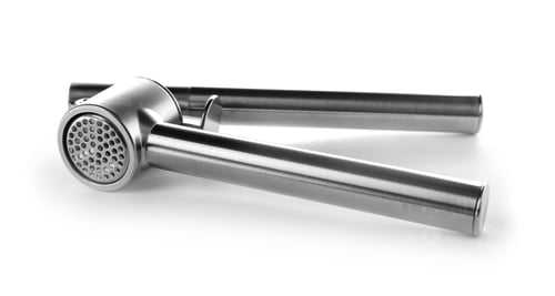 Preview: Garlic press on white background. Kitchen utensil