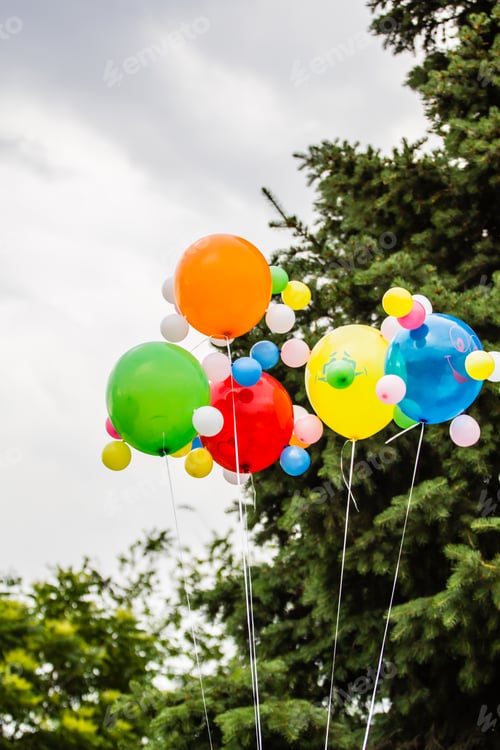 Preview: Multicolored balloons against the background of a cloudy sky