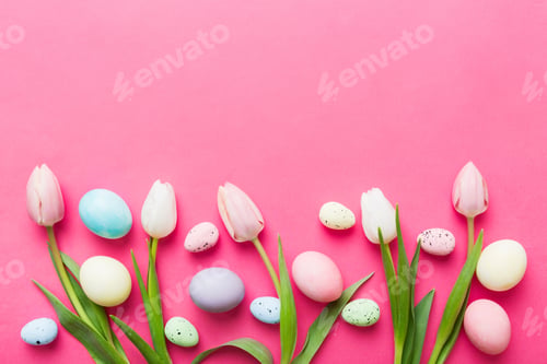 Preview: Happy Easter composition. Easter eggs on colored table with yellow Tulips. Natural dyed