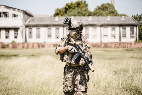 Preview: Soldier in protective combat uniform, Soldier with rifle in forest