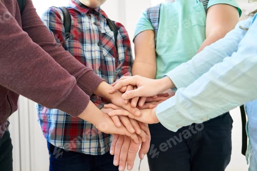 Preview: Children hands touching holding together under each other
