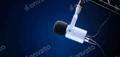 Preview: Microphone in studio. Professional studio microphone with a pop filter is suspended boom arm and studio lights. Set up mic for podcast voice over or recording high quality sound audio in a controlled.