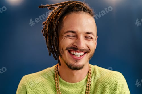 Preview: Close-up portrait of a young stylish man with dreadlocks