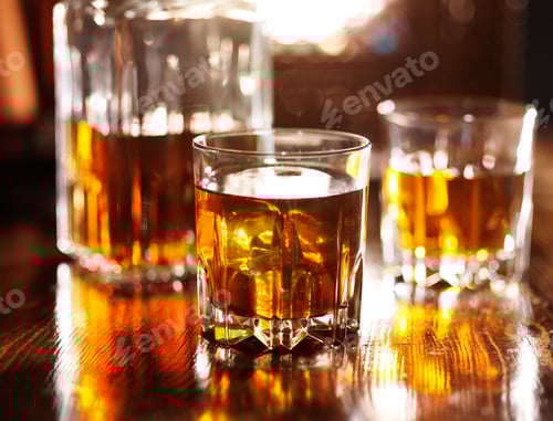 Preview: two glasses of whiskey with decanter