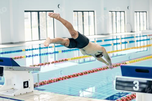 Preview: Sports, swimming pool and man diving in water for training, exercise and workout for competition. F