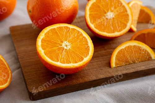 Preview: Raw Organic Sweet Oranges on a wooden board, low angle view. Close-up.