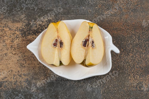 Preview: Two slices of quince on leaf shaped plate
