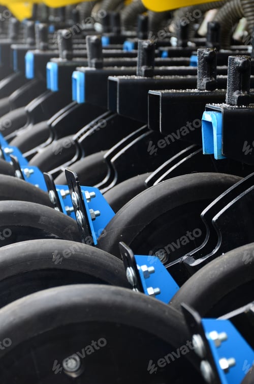 Preview: Row of wheels of the new industrial agricultural seeder close up