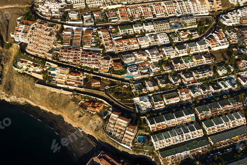 Preview: Top view of the houses located on the rock of Los Gigantes at sunset, Tenerife, Canary Islands