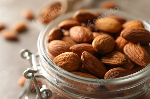 Preview: Glass jar with almond, close up. Vitamin food