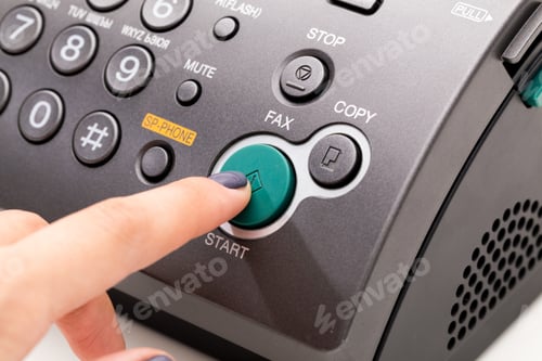 Preview: Woman's hand using fax machine close up