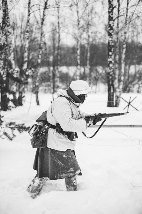 Preview: German Wehrmacht Infantry Soldier In World War II Attacking With Rifle In Winter Day. Historical Re