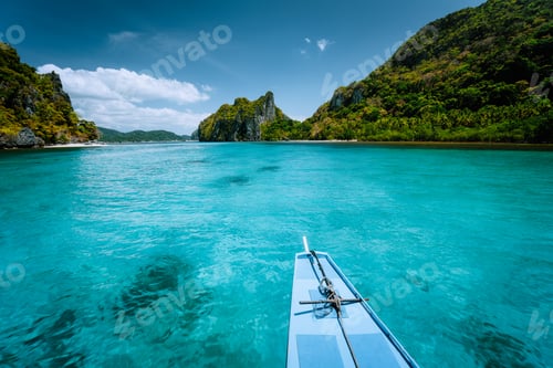 Preview: Boat trip to tropical islands El Nido, Palawan, Philippines. Steep green mountains and blue water