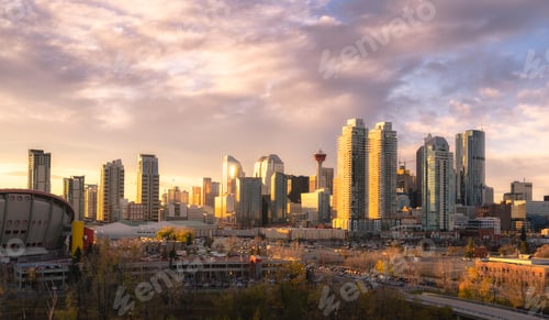 Preview: Calgary cityscape lit up at dawn.