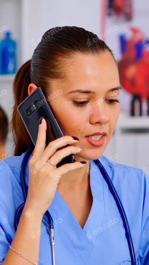 Preview: Medical assistant talking at smartphone with doctor asking for advice