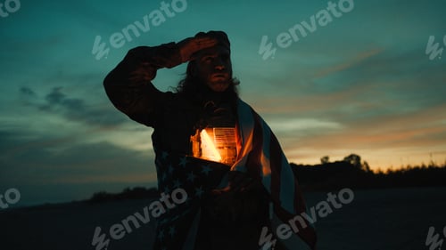 Preview: Silhouette of an American soldier saluting in front of the sunset a Memorial Day