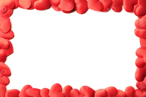 Preview: red hearts from above on pure white background framing the entire rectangular image